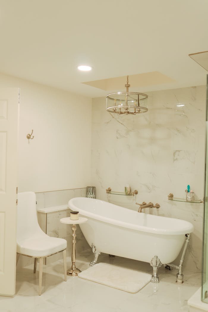 Elegant bathroom featuring a white freestanding bathtub and minimalist design in Gulf Shores, AL.